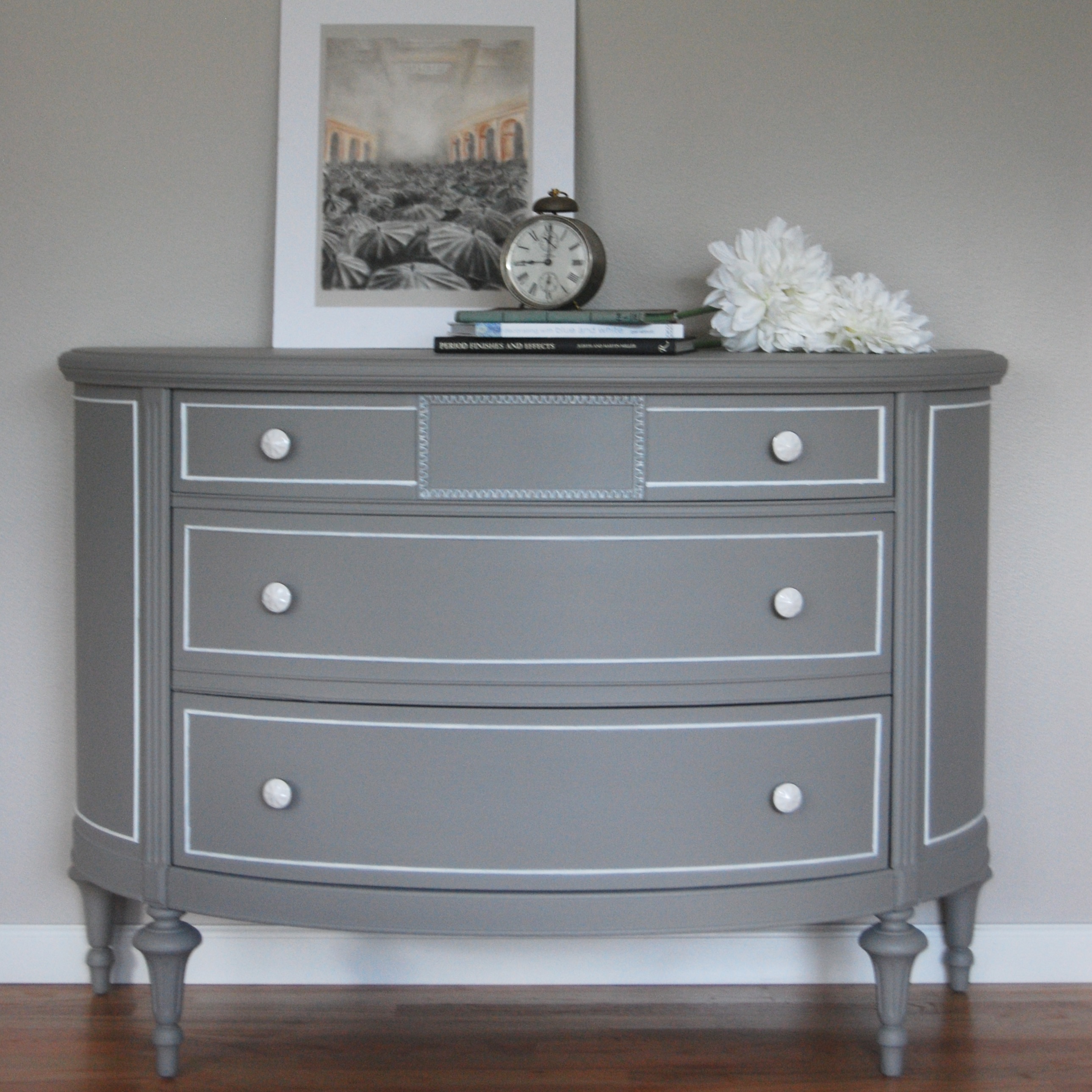 A grey demi lune dresser with white accents - The Weathered Door